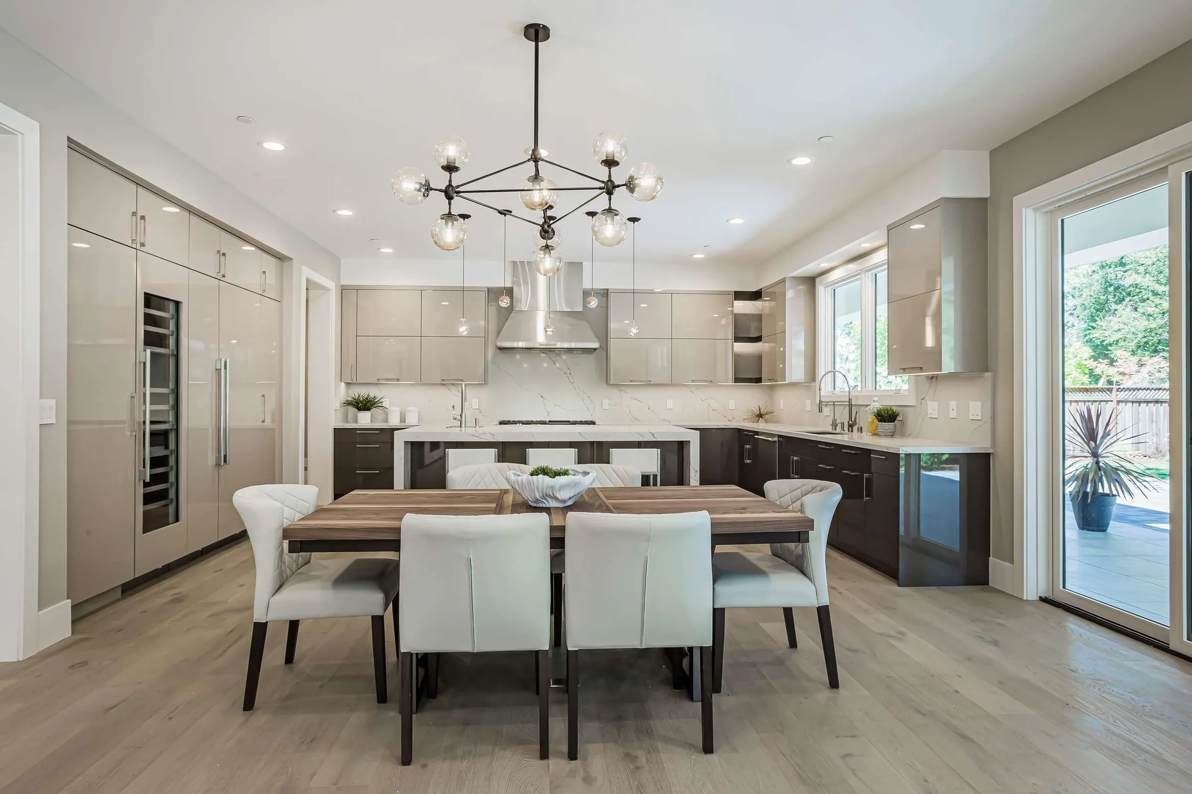 Kitchen and dining room of the custom home at 1085 Golden Way, Los Altos
